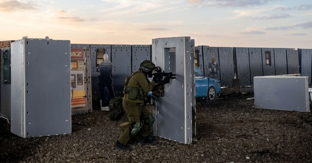 Outdoor tactical scenario training uses vehicles, barricades, targets, street layouts, and outdoor furniture to create realistic training context.
