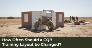 CQB instructors reviewing a reconfigurable training layout with modular walls, doors, and multiple room configurations.